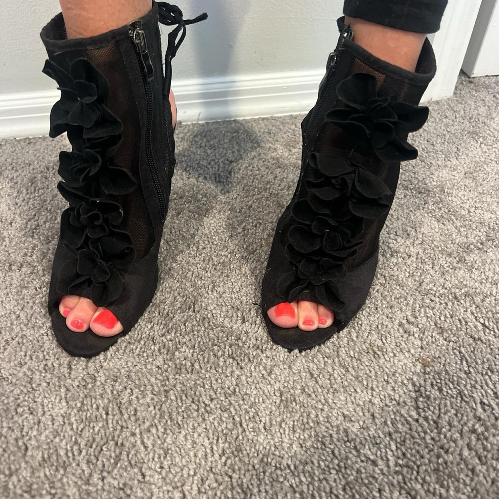 Black heels with flower accents